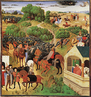 Color medieval illuminated manuscript miniature showing two armies of mounted knights with lances converging in a green landscape, with a fortified building at right where figures look on from a window.